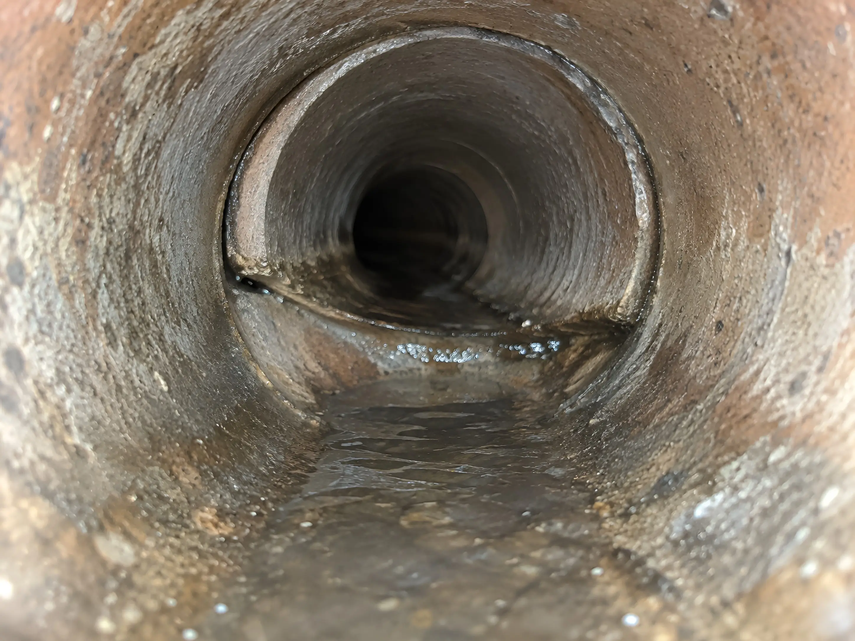 Camera view of an offset joint where two sections of pipe meet